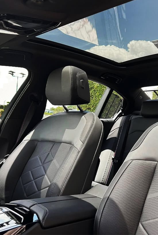 Luxury car rental interior by Carleone in Bangkok Thailand, premium limousine service for airport transfers and executive transportation.