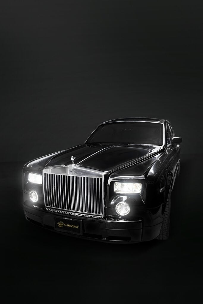 Luxury black Rolls Royce car from Carleone, Bangkok Thailand, showcasing premium limousine service, luxury car rental, and airport transportation in an elegant setting.