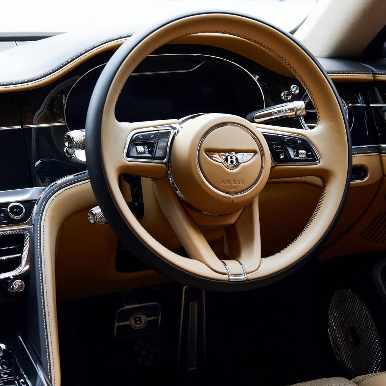 Luxurious Carleone interior inside a Bentley in Bangkok, Thailand, showcasing premium leather seats, advanced dashboard, and high-end features for luxury car rental and limousine service at the airport.