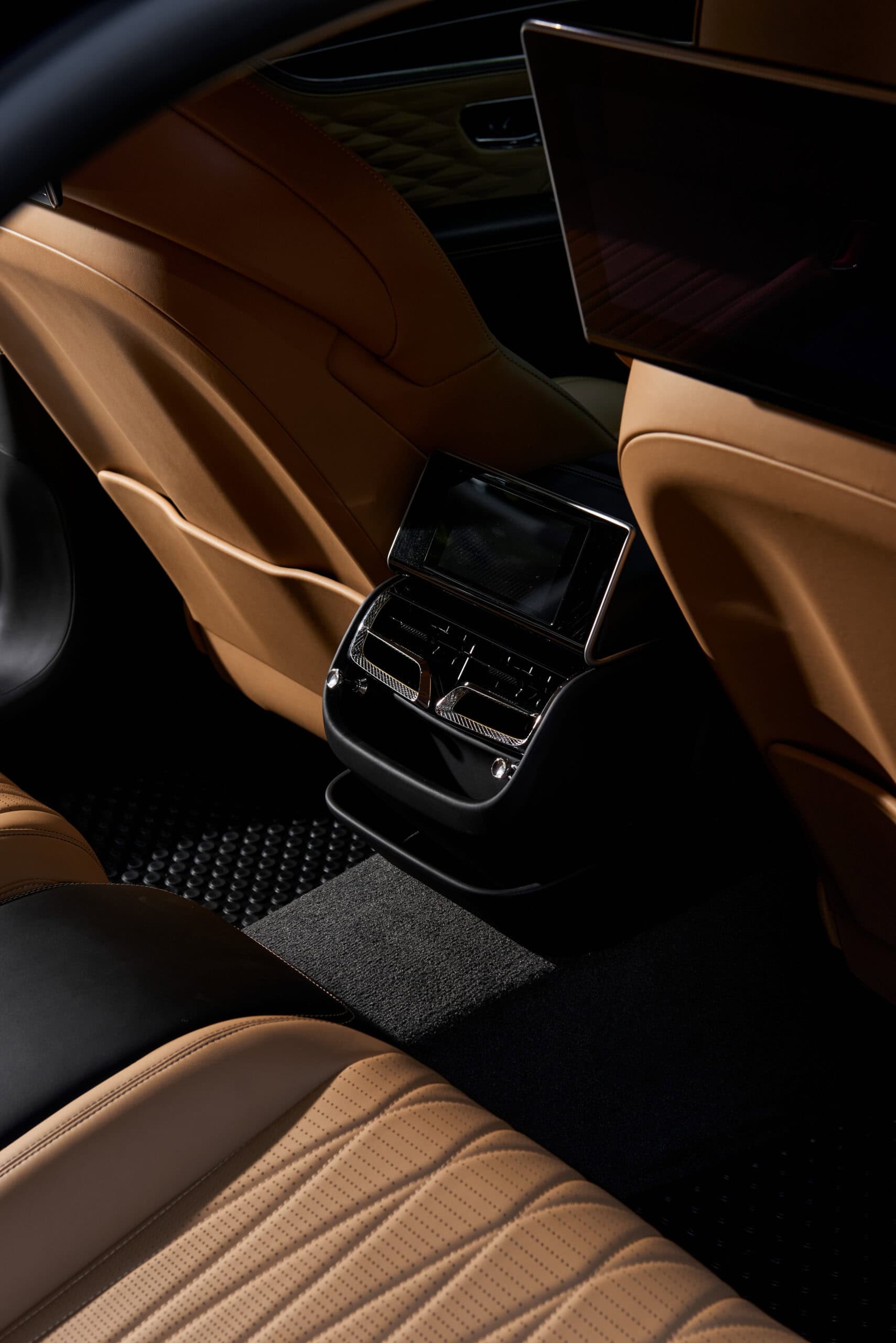 Luxurious Carleone rental car interior in Bangkok, Thailand, showcasing premium leather seats and advanced climate control for a seamless limousine service experience.