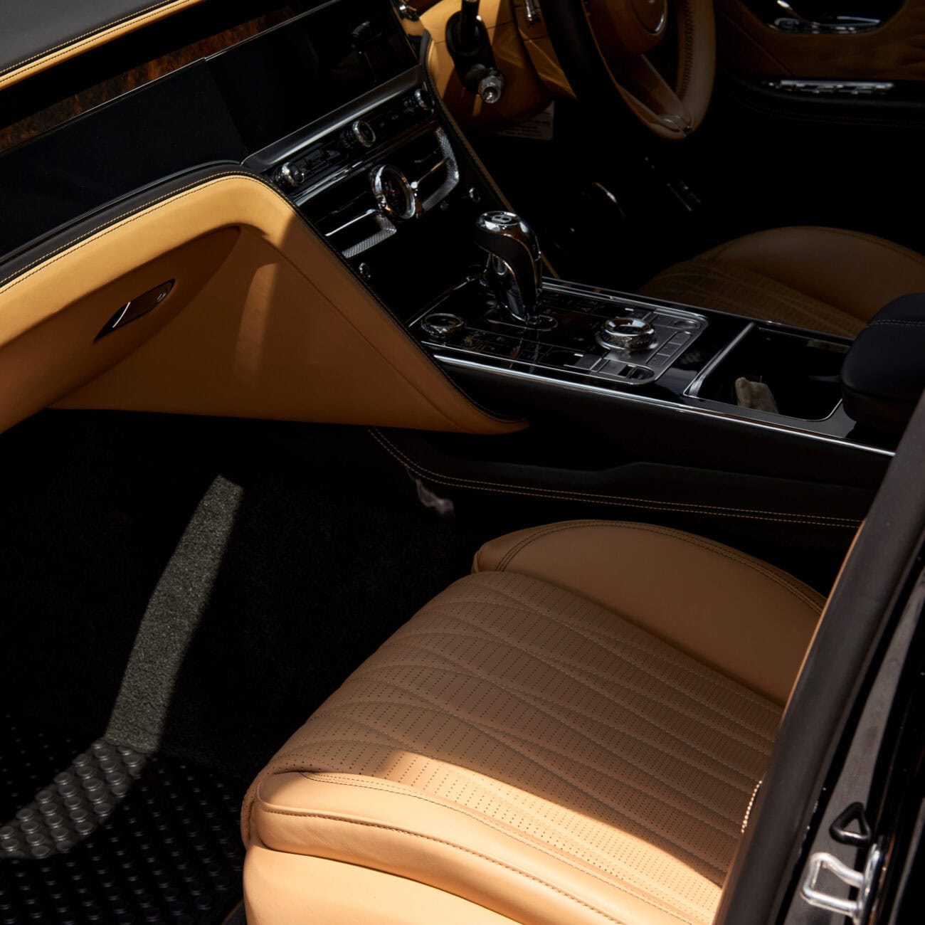 Luxurious Carleone limousine interior in Bangkok, Thailand, showcasing premium leather seats and advanced controls for luxury car rental and airport limousine services.